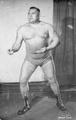 Wrestler in stance poses for an advertising photo