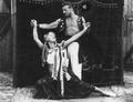 Theatrical performance of the athlete with his partner in unknown wandering circus