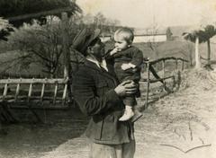 Man with a child on his arms