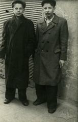 Boys against the background of a closed store