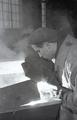 Welding in the midst of water vapor at the factory of metal structures