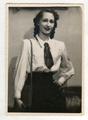 Young woman in a blouse with a tie
