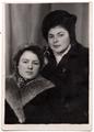 Women wearing coats and hats