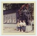 Vova with his mother and aunt Inna near the "Doshka poshany" (ukr.) / “Board of Honor” (eng.)