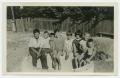 Children in front of the house