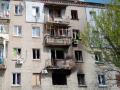 Пошкоджений вибухом будинок