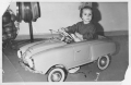 Behind the wheel of a children's Moskvitch