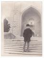 Portrait of a man against the backdrop of a madrasa