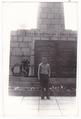 Portrait of a young man near a monument