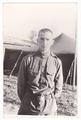 Portrait of a soldier against the backdrop of a tent