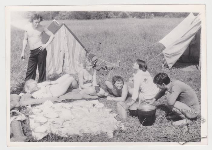 Portrait of young people near tents 1