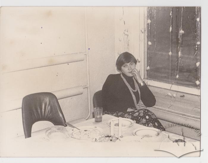 Portrait of a woman at a table 1