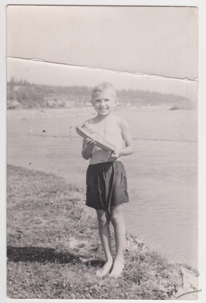 With a toy boat 1