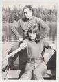 Portrait of a woman with a man in a boat