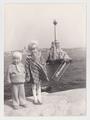 Portrait of a boy and a girl against the backdrop of the Monument to Sunken Ships