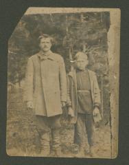 Portrait of a father with his son in the forest